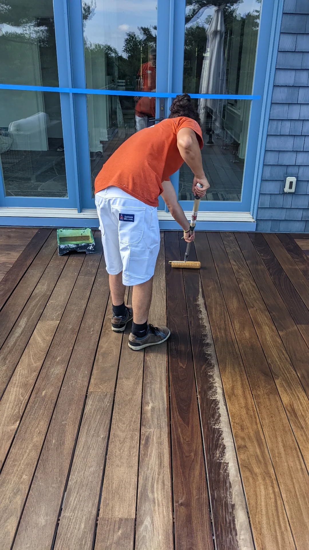 Deck staining in progress on a Muskoka cottage